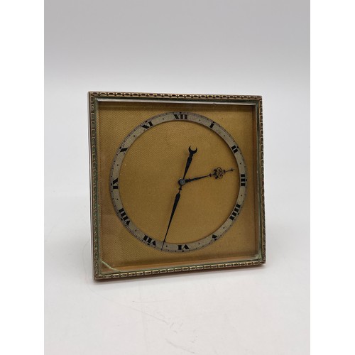 670 - EIGHT DAY EASEL BACKED TRAVELLING CLOCK