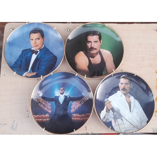 690 - FOUR DANBURY MINT BONE CHINA FREDDIE MERCURY PLATES AND SOME PRINTS