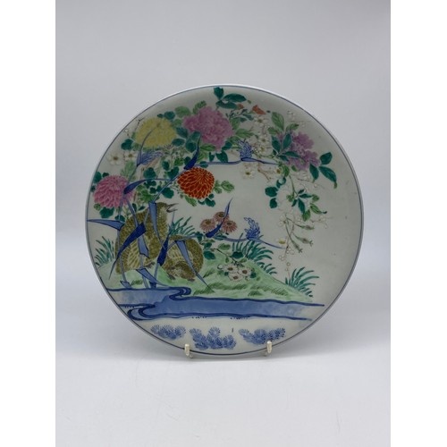 526 - JAPANESE CHARGER PAINTED WITH QUAIL AND CHRYSANTHEMUMS AND A FAMILLE ROSE PLATE DECORATED WITH BRIDS... 