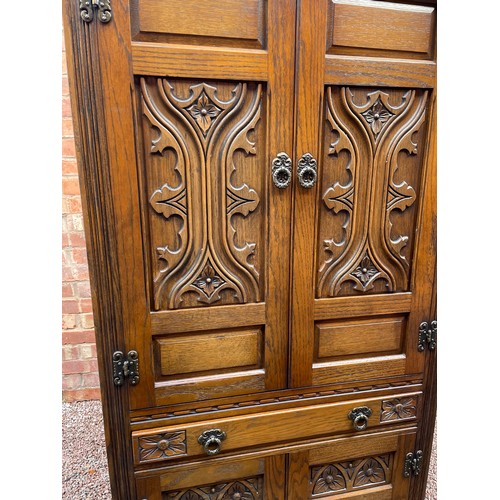 136 - OLD CHARM OAK LINEN FOLD CARVED UPRIGHT DRINKS CABINET