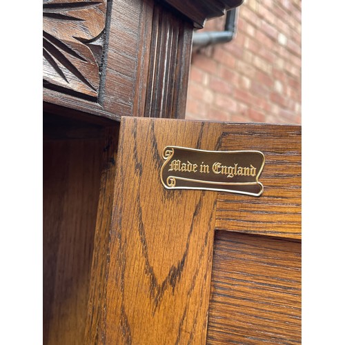 136 - OLD CHARM OAK LINEN FOLD CARVED UPRIGHT DRINKS CABINET