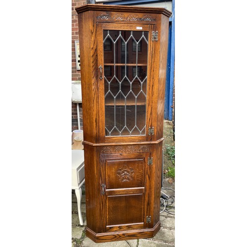 155 - WEBBER OAK TUDOR ORSE AND LUNETTE CARVED LEADED GLAZED CORNER CABINET