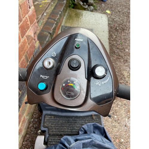 228 - TGA MOBILITY SCOOTER WITH CHARGER AND UPVC COVER