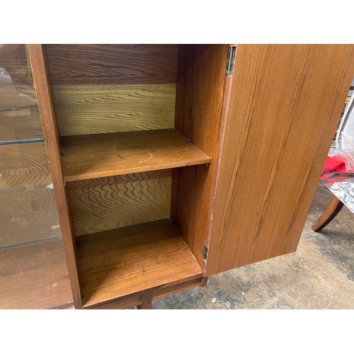 193 - 1970S TURNIDGE TEAK NARROW BOOK CASE WITH SLIDING GLASS DOORS