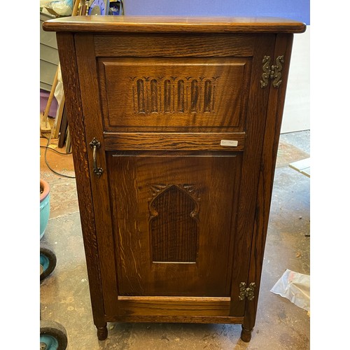 217 - WEBBER OAK TALL CUPBOARD WITH CARVED PANEL DOOR