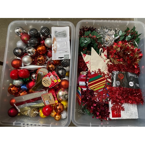 112 - TWO CLEAR CRATES OF VARIOUS CHRISTMAS BAUBLES AND TINSEL