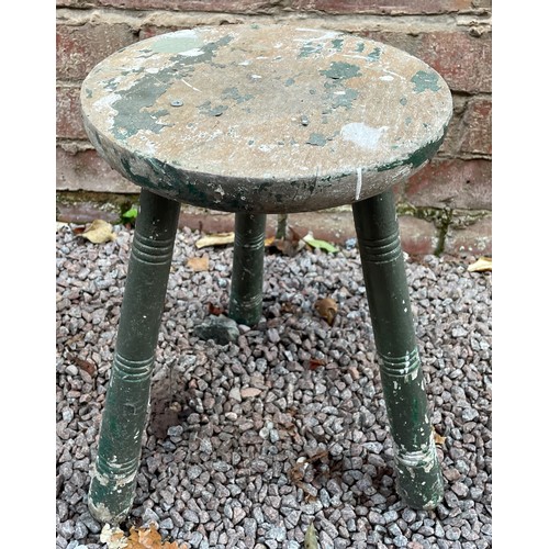 223 - GREEN PAINTED MILKING STOOL AND AN ART STUDIO STOOL