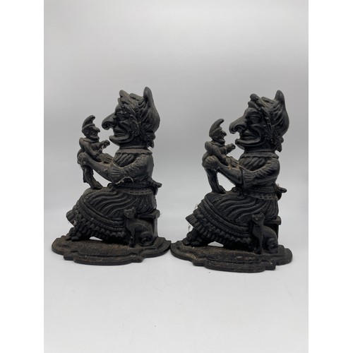 429 - TWO BLACK CAST PUNCH AND JUDY DOOR STOPPERS