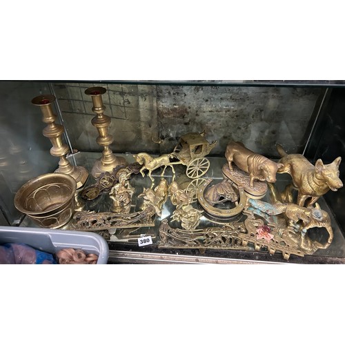 380 - SHELF OF BRASS BULL AND DOG FIGURES, PAIR OF KNOPPED CANDLE STICKS AND OTHER ORNAMENTAL BRASS