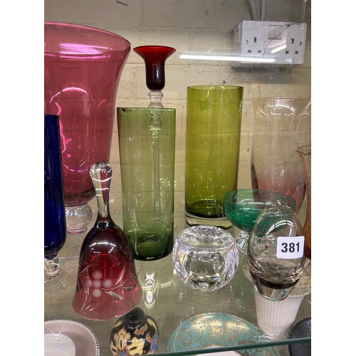 381 - SHELF OF 20TH CENTURY COLOURED GLASSWARES, RUBY AND BLUE SPILL VASES, OVOID VASE, DECORATIVE BELL