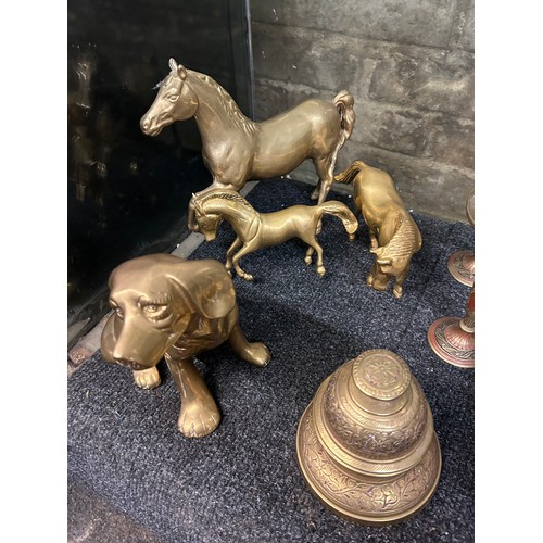 392 - SHELF OF BRASS KNOPPED CANDLE STICKS, CHAMBER STICK, TOASTING FORK AND HORSE AND DOG ANIMAL FIGURES