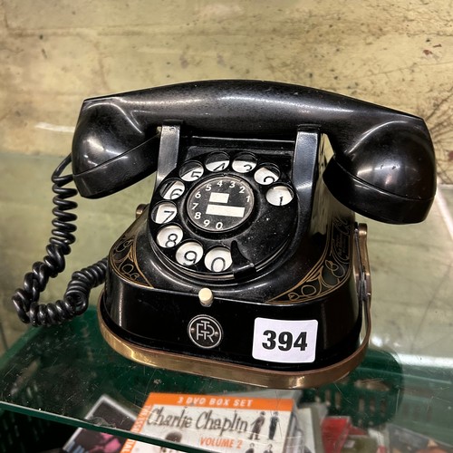 394 - OLD STYLE BLACK AND GILT RING DIAL TELEPHONE