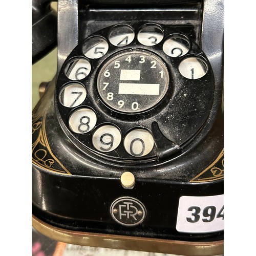 394 - OLD STYLE BLACK AND GILT RING DIAL TELEPHONE