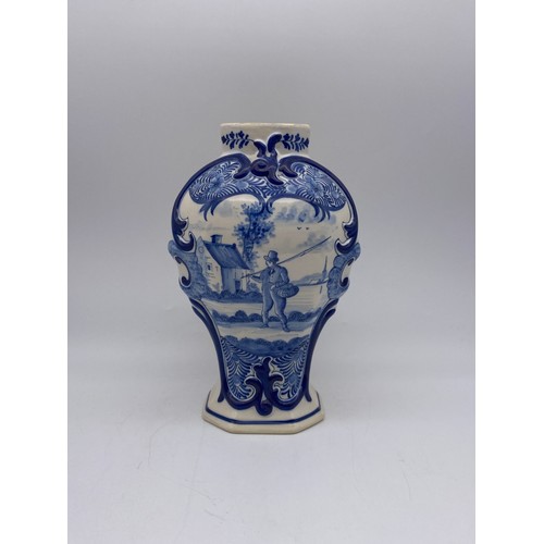 445 - DELFT BLUE AND WHITE OVOID VASE DECORATED WITH A FISHERMAN