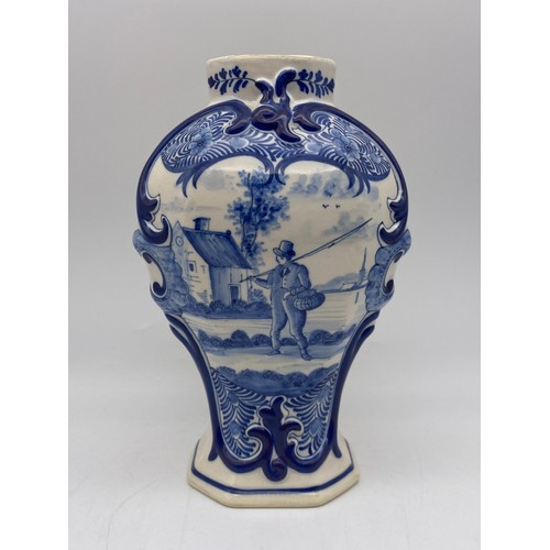 445 - DELFT BLUE AND WHITE OVOID VASE DECORATED WITH A FISHERMAN