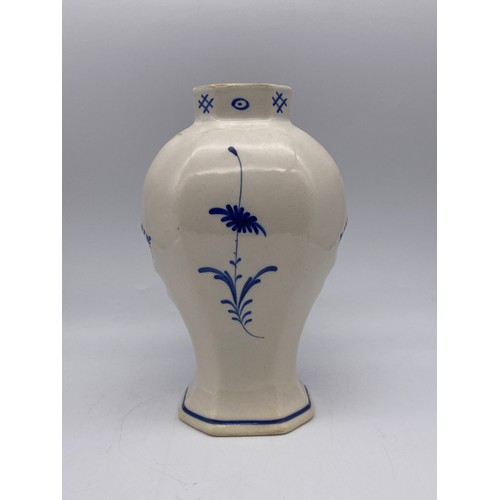 445 - DELFT BLUE AND WHITE OVOID VASE DECORATED WITH A FISHERMAN