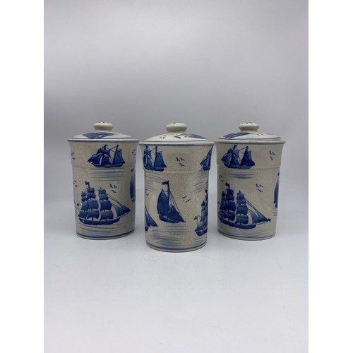 447 - THREE 209TH CENTURY CRACKLE GLAZED BLUE AND WHITE JARS AND COVERS