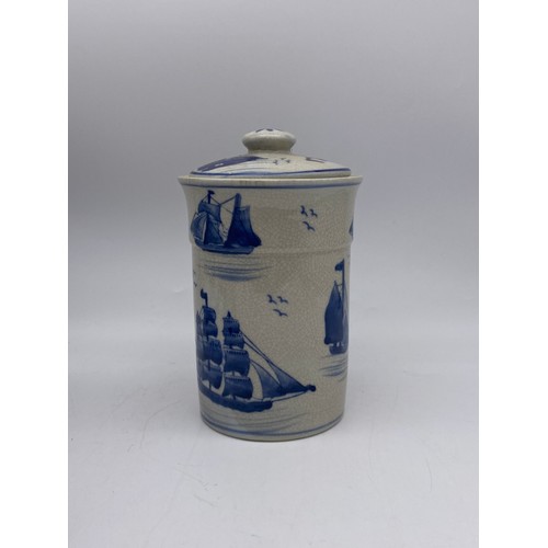 447 - THREE 209TH CENTURY CRACKLE GLAZED BLUE AND WHITE JARS AND COVERS