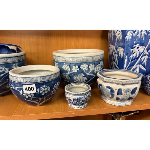 400 - SHELF OF 20TH CENTURY ORIENTAL BLUE AND WHITE PRUNUS DECORATED BOWLS AND VASES