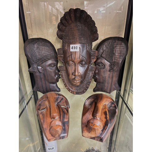 410 - SERIES OF CARVED TRIBAL FACE MASKS AND PLAQUES INC SOME BY FELIX OGBE OSO