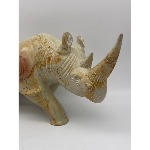 468 - CARVED MOTTLED SOAPSTONE MODEL OF RHINOCEROS AND SMALLER EXAMPLE