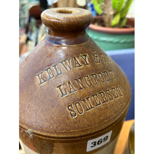 369 - STONEWARE ADVERTISING FLAGON, STORAGE JARS AND DEMI GLAZED PITCHER