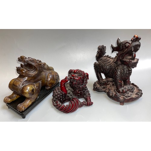 460 - RESIN AND SOAPSTONE CARVED MODELS OF FOO DOGS AND KYLIN