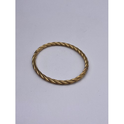 703 - 9CT GOLD HOLLOW ROPE TWIST BANGLE 6G APPROX