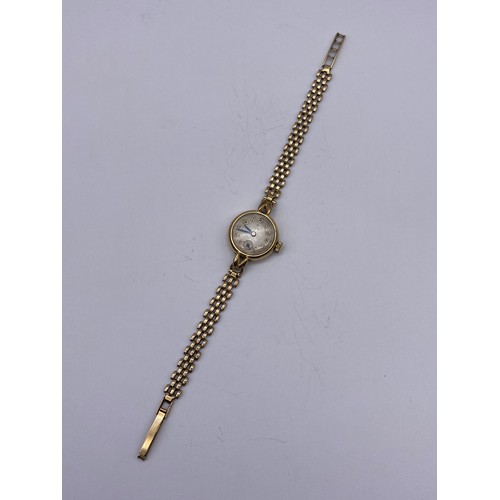 700 - LADIES TUDOR 9CT CASED CIRCULAR WRISTWATCH ON 9CT THREE STRAND STRAP 18G OVERALL APPROX