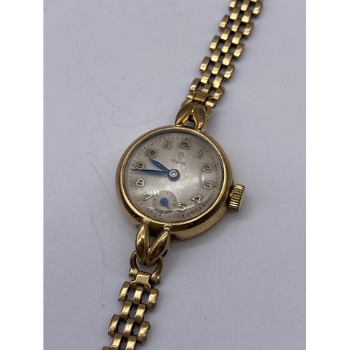 700 - LADIES TUDOR 9CT CASED CIRCULAR WRISTWATCH ON 9CT THREE STRAND STRAP 18G OVERALL APPROX