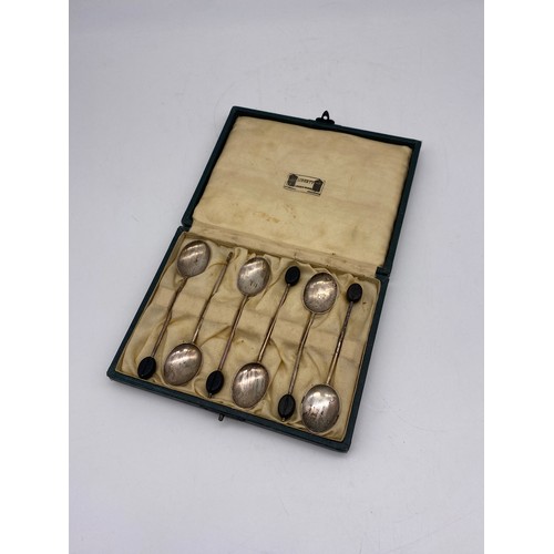 694 - CASED SILVER TEA SPOONS WITH BEAN FINIALS (ONE A/F)