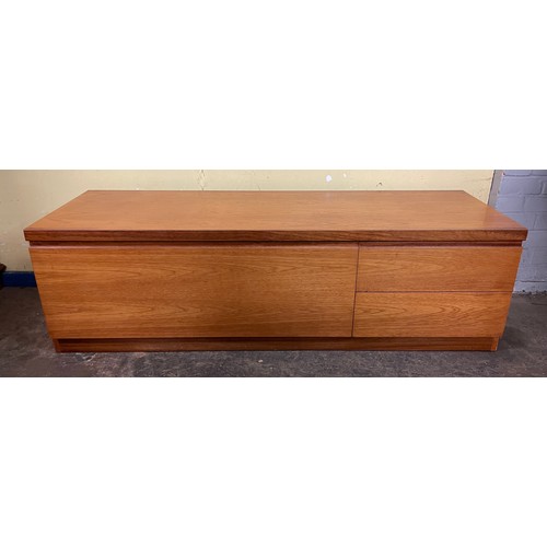 136 - TEAK LOW SIDEBOARD FITTED WITH FALL FLAP AND TWO DRAWERS