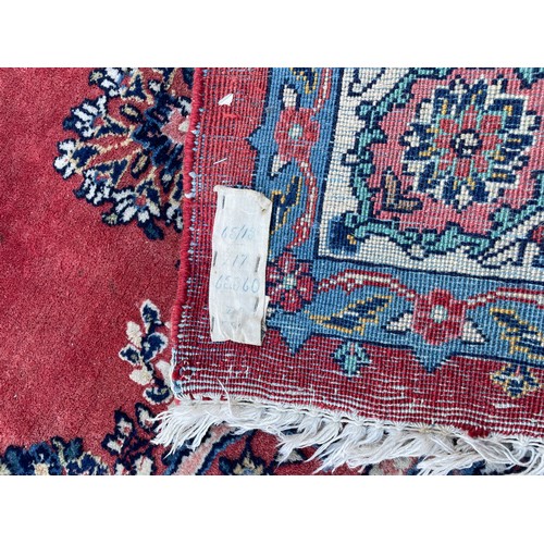 191 - LARGE GEOMETRIC RED PATTERNED RUG