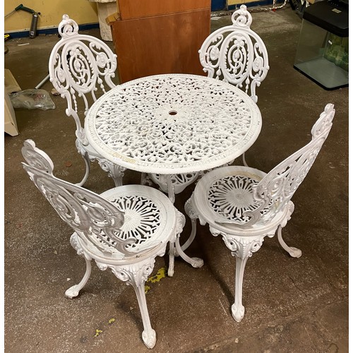 94 - WHITE PAINTED CAST IRON VICTORIAN STYLE PATIO TABLE AND FOUR CHAIRS