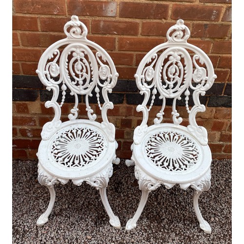 94 - WHITE PAINTED CAST IRON VICTORIAN STYLE PATIO TABLE AND FOUR CHAIRS