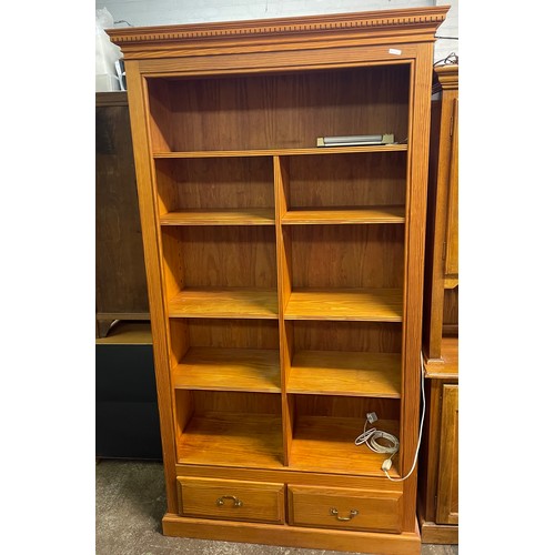 20 - GOOD QUALITY PINE UPRIGHT PIGEON HOLE BOOKCASE WITH TWO DRAWER BASE