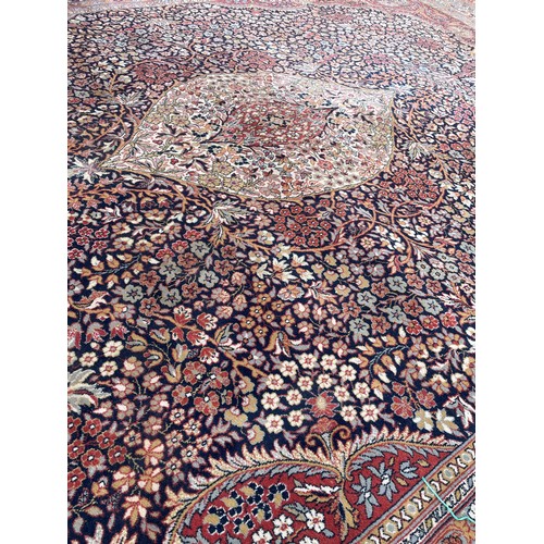 53 - RUSSETT GROUND FLORAL PATTERN CARPET 8FT X 11FT