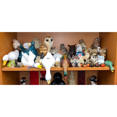 321 - SHELF OF RESIN AND POTTERY OWL AND GEESE FIGURES