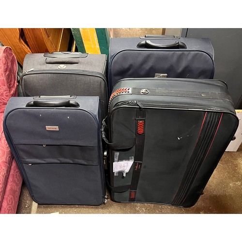 135 - FOUR NYLON SUITCASES