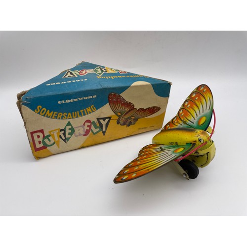 597 - BOXED SOMERSAULTING CLOCKWORK BUTTERFLY TOY NO.504