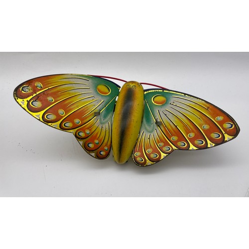 597 - BOXED SOMERSAULTING CLOCKWORK BUTTERFLY TOY NO.504