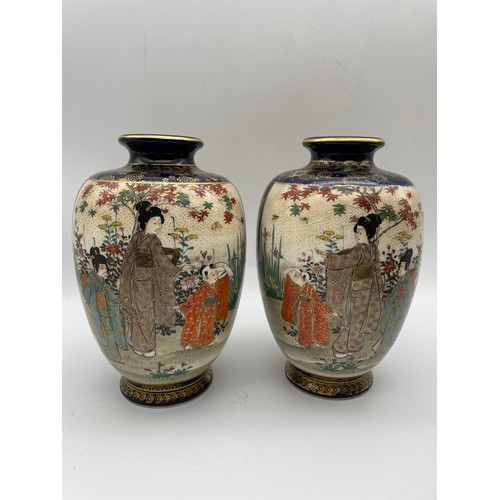 497 - PAIR OF JAPANESE SATSUMA VASES DECORATED WITH PANELS OF GEISHAS