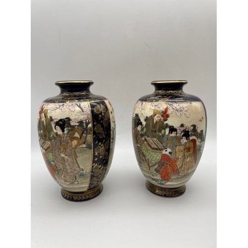 497 - PAIR OF JAPANESE SATSUMA VASES DECORATED WITH PANELS OF GEISHAS