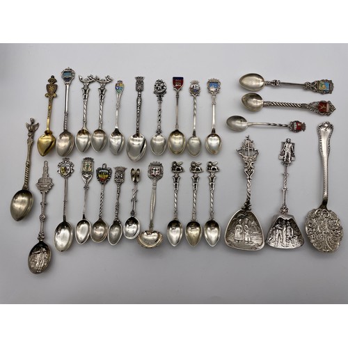 456 - SELECTION OF CONTINENTAL CAST AND WHITE METAL SOUVENIR SPOONS