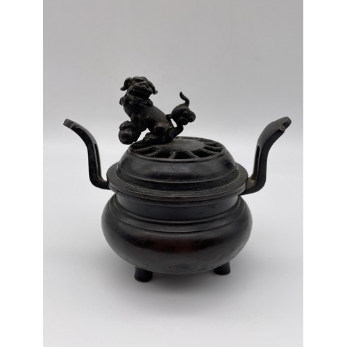 457 - CHINESE BRONZE CENSER WITH LION FINIAL AND UPSWEPT HANDLES