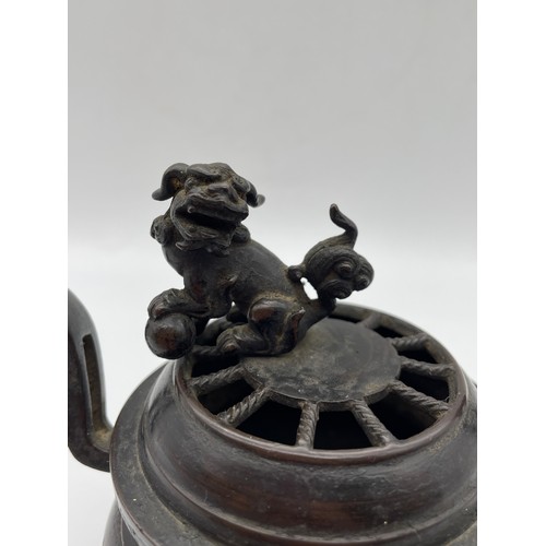 457 - CHINESE BRONZE CENSER WITH LION FINIAL AND UPSWEPT HANDLES