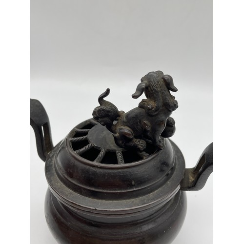 457 - CHINESE BRONZE CENSER WITH LION FINIAL AND UPSWEPT HANDLES