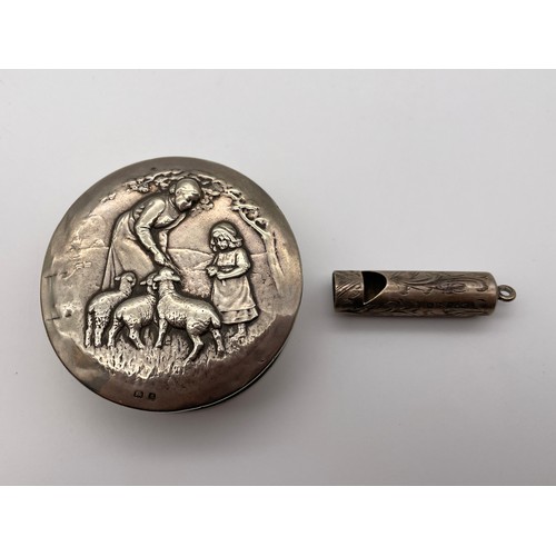 483 - BIRMINGHAM SILVER REPOUSSE TIN WITH FIGURES AND LAMB DECORATION AND A SMALL ENGRAVED WHISTLE