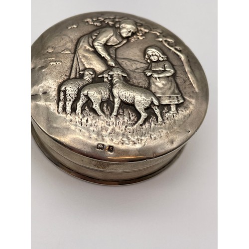 483 - BIRMINGHAM SILVER REPOUSSE TIN WITH FIGURES AND LAMB DECORATION AND A SMALL ENGRAVED WHISTLE