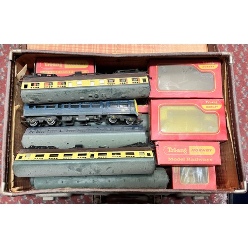 586 - THREE BROWN LEATHER CASES CONTAINING LOCOMOTIVE MODEL AND ACCESORIES INC. BOXED HORNBY AND TRACK